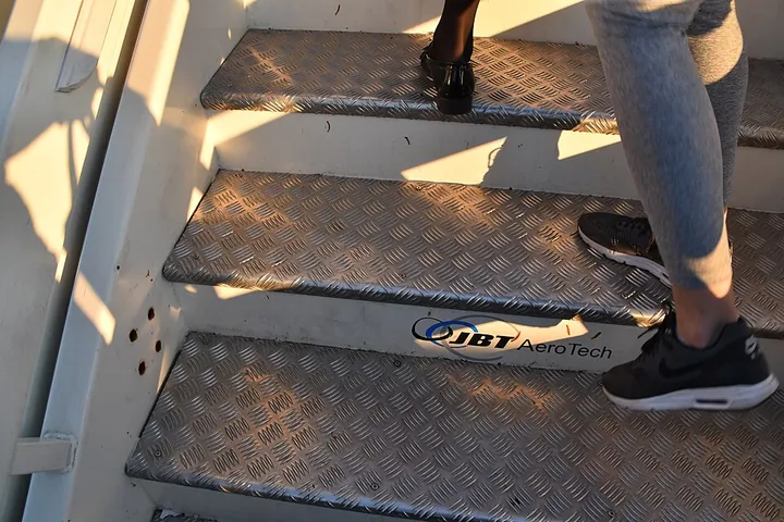 A close-up of passenger-stair treads at Kyiv International Airport