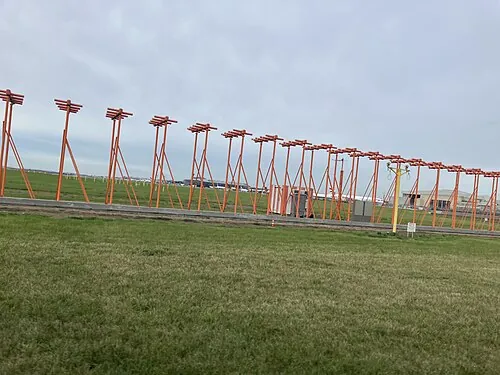 Red localizer antenna supports at London Heathrow Airport.