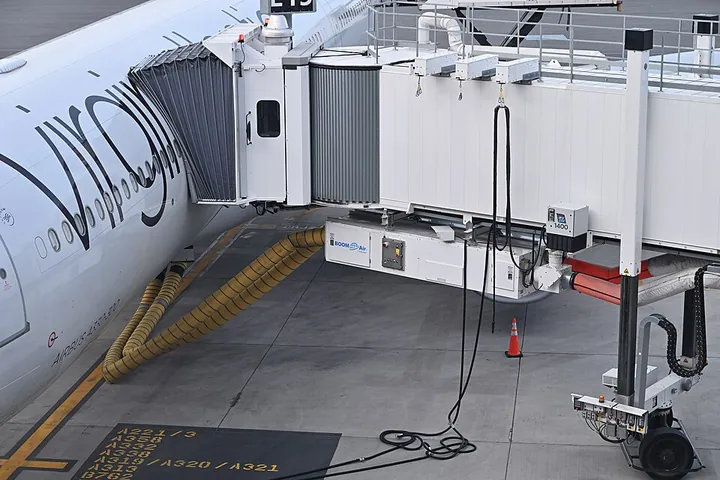 The boarding bridge at gate E15 beside a Virgin Atlantic Airbus A330 at Boston Logan Airport