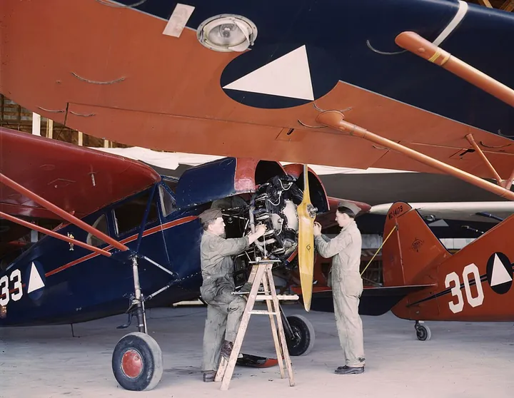 A Fairchild 24 undergoes maintenance in a Civil Air Patrol hangar.
