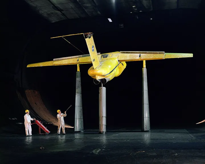 An augmentor-wing model is tested in a large wind tunnel.