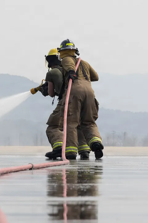 Marines taking part in a simulated aircraft-firefighting drill at Gwangju Air Base