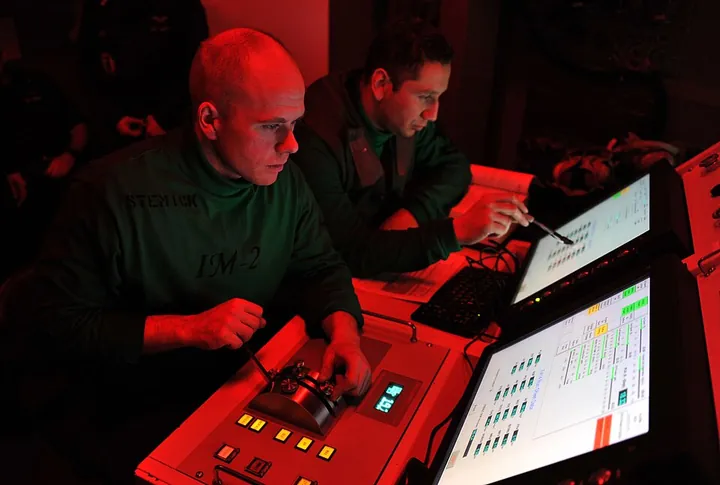 Technicians conduct an engine run in an intermediate-maintenance department.
