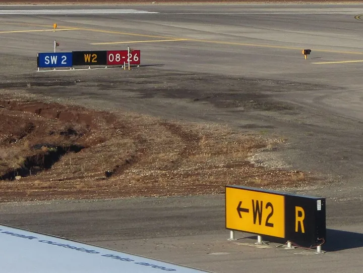 Four types of airfield signs together at Ben Gurion Airport