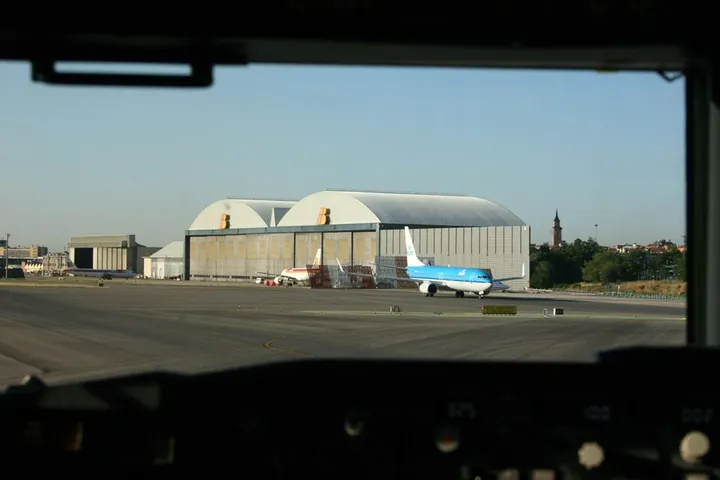 An airline maintenance hangar provides a large sheltered workspace.