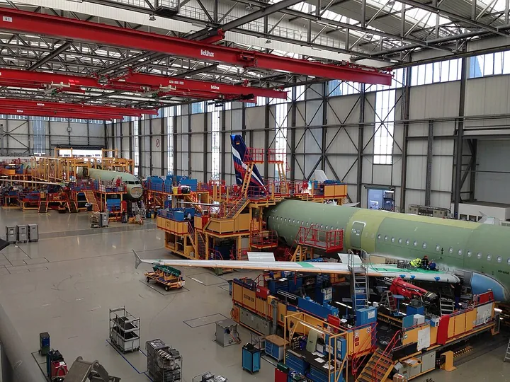An A321 is shown on an aircraft final-assembly line.