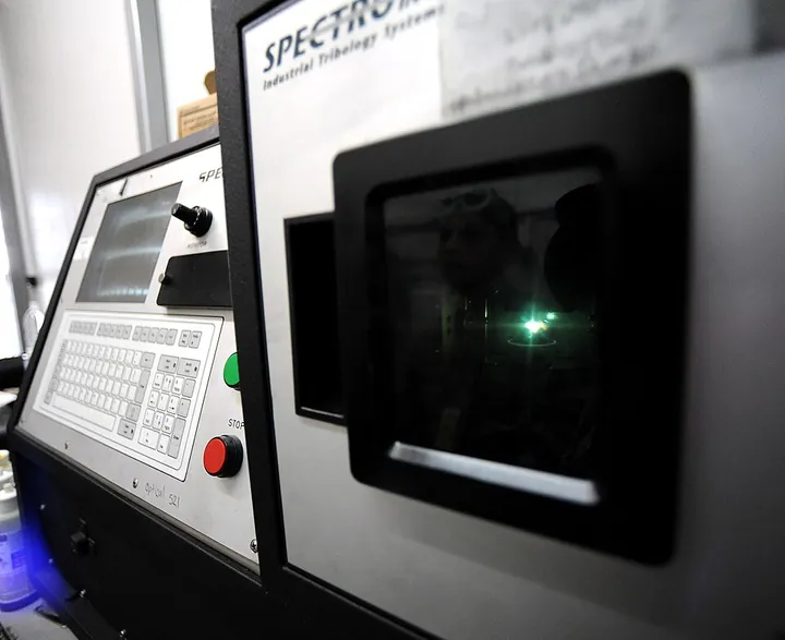 An oil-analysis unit tests an aircraft engine oil sample.