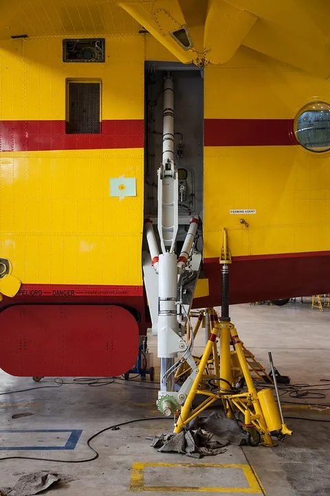 A close view shows the left landing gear of a Canadair CL-215.