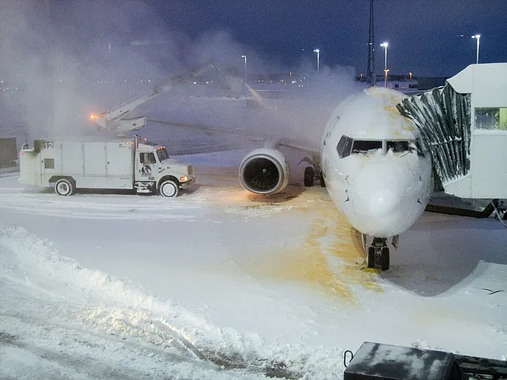 A Boeing 737 being deiced at its gate at Milwaukee Airport