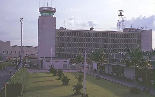 Historical view of Singapore airport's control tower and terminal building.