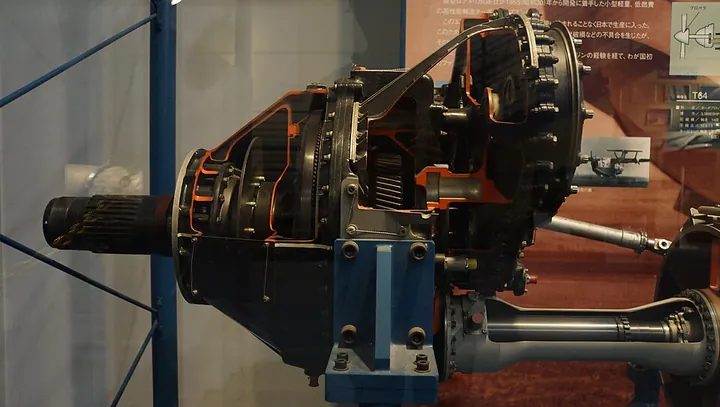 The gearbox section of a turboprop engine is opened for display.