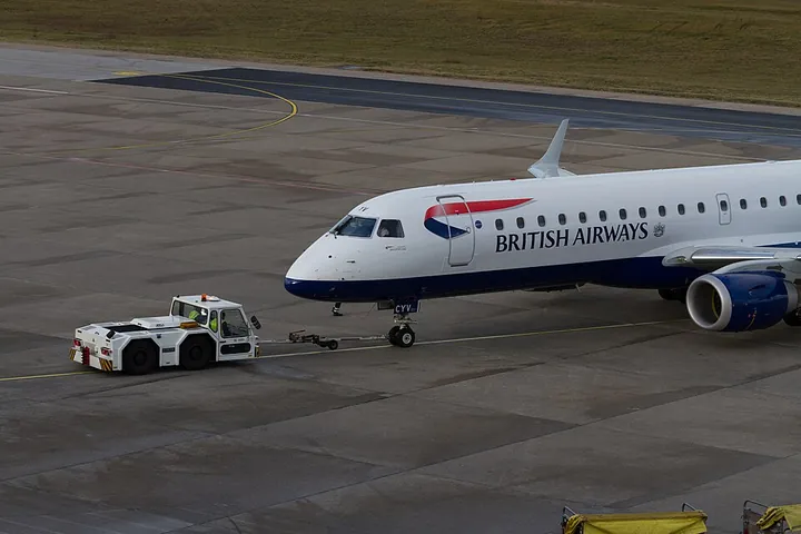 A British Airways Embraer 190 being pushed back at Berlin Tegel Airport