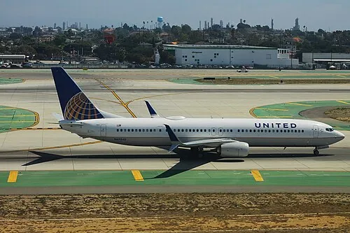 United Airlines Boeing 737 rolling along the runway after landing.