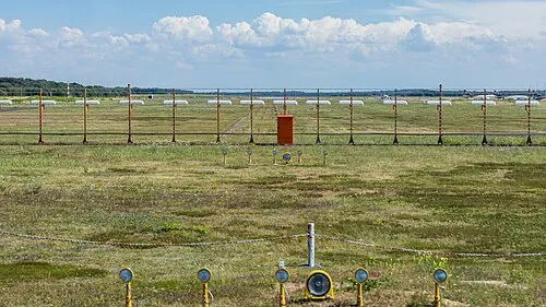Approach lights and localizer equipment at Cologne Bonn Airport.