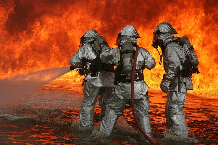 Aircraft rescue and firefighting personnel tackling a simulated fire at Miramar