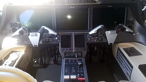 HondaJet cockpit with two pilot seats and electronic displays.