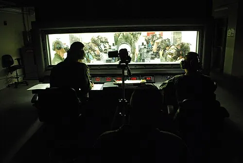 People seated inside a hypobaric training chamber.