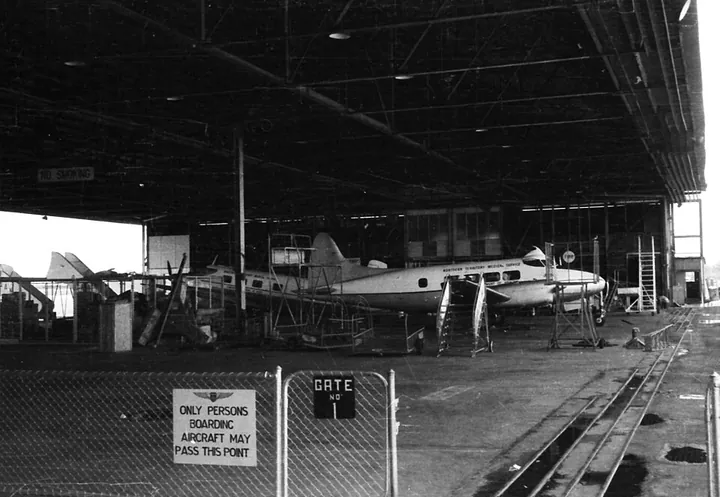 Civil aircraft occupy a maintenance hangar in Darwin in 1959.