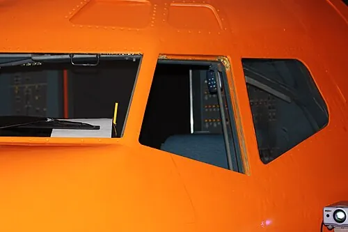 Orange exterior shell and windows of a Boeing 737 simulator.