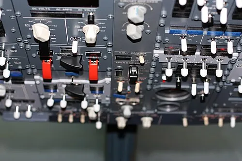 Switches and selectors on a Boeing 737 simulator's overhead panel.